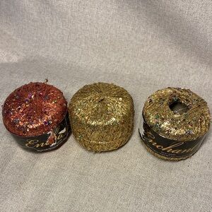 Premier Enchant Sparkling Yarn Set in Red and Gold. 3 skeins. New.